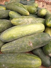 vegetables in traditional markets. tomatoes, cucumbers, carrots, broccoli, red squash, white squash, and many other vegetables