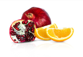 Pomegranate and orange slices isolated on white background.