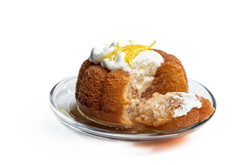 Rum baba decorated with whipped cream isolated on white