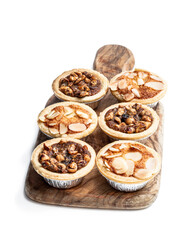Christmas mini mince pie on wooden board isolated on white