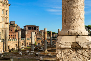 Fototapeta na wymiar Traiano Column is a Roman triumphal column that commemorates Roman emperor Trajan's victory in the Dacian Wars. Located in Trajan's Forum, built near the Quirinal Hill, Roman Forum, Rome Italy