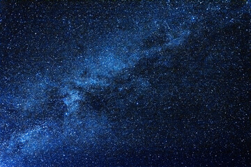 Breathtaking blue clear night sky with milky way and huge amount of stars.