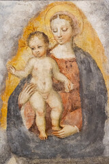 A fresco of the Virgin Mary with Infant Jesus in the "Santa Maria del Carmine" church (Holy Mary of Carmel) in Pavia, Italy. Shot in 2017.
