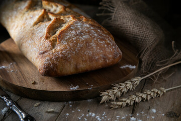 
Fresh bread on a wooden table in rustic style