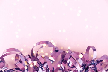 Beautiful festive background. Background with shiny violet decor and lights. Place for text and your design.