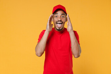 Delivery employee african man in red cap blank print t-shirt uniform workwear work courier service...
