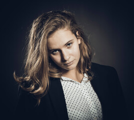 Studio portrait of young beautiful longhaired woman