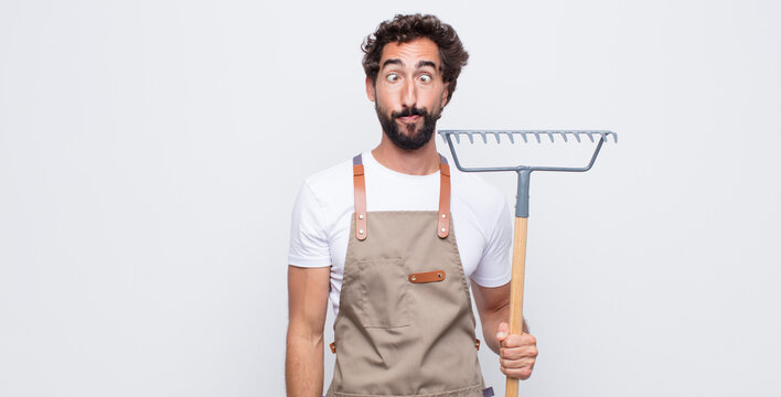 young man looking goofy and funny with a silly cross-eyed expression, joking and fooling around