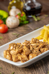 grilled cubed chicken with past and salad