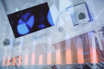 Double exposure of financial graph drawing and office interior background. Concept of stock market.