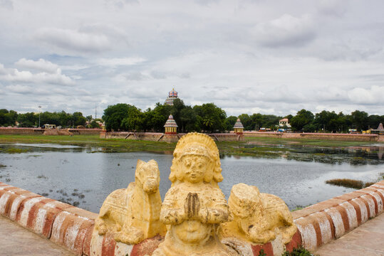 Madurai, India - November 02, 2018: Statue at a corner of Vandiyur Mariamman Temple or Maariamman Kovil Teppakulam premises in Madurai city in Tamil Nadu during day time against cloudy sky