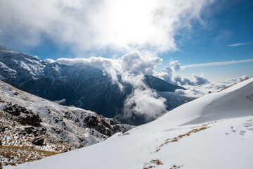 Fototapeta na wymiar Thick clouds and white mountains, Nepal