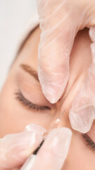 Forehead injection at spa salon. Doctor hands. Closeup. High quality. Pretty female patient. Beauty...