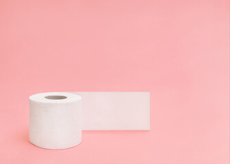 Toilet paper roll Photo with copy space Unrolled toilet paper on light pink backdrop