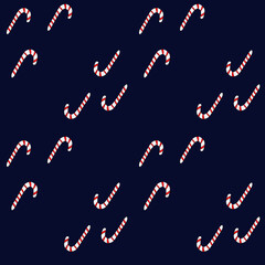 Fototapeta na wymiar Seamless pattern with peppermint candy sticks on navy blue background