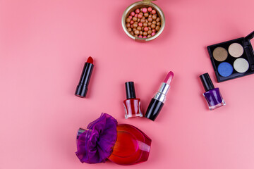Obraz na płótnie Canvas Set of decorative cosmetics on a pink background. Top view, flat lay