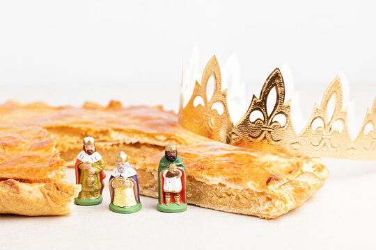 King cake or galette des rois in French. Traditional epiphany pie with golden paper crown and charm