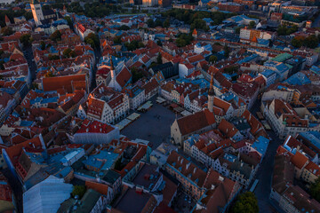 Amazing aerial drone shot of old town of Tallinn, Estonia at sunset