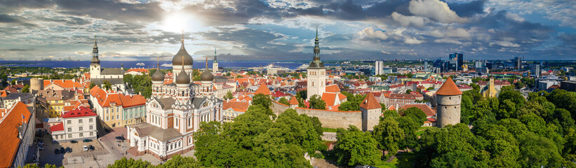 Amazing aerial drone shot of old town of Tallinn, Estonia at sunset