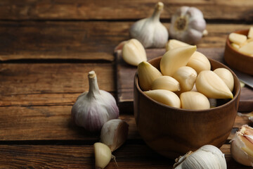 Fresh organic garlic on wooden table, closeup