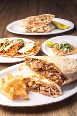 Mexican food background. Party mexican food. Mexican food concept on wooden table. Traditional Mexican food. Tacos.