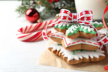 Obraz na płótnie Canvas Delicious Christmas cookies on white wooden table