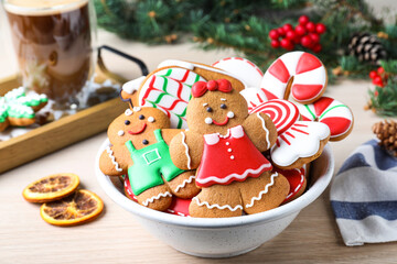 Delicious Christmas cookies in bowl on wooden table
