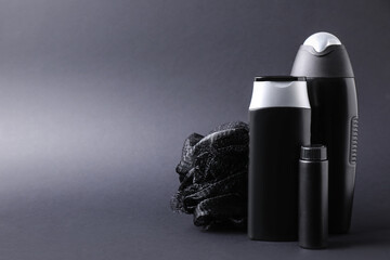 Set of different men's cosmetic products on black background. Space for text