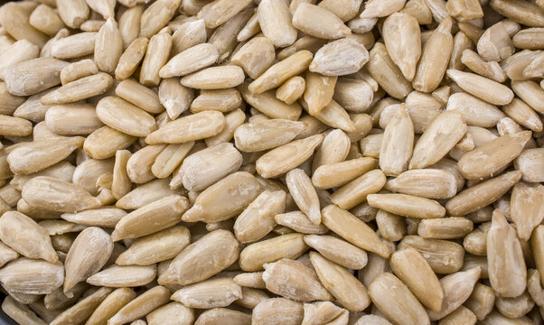 Sunflower seeds in  bowl on wooden  background.