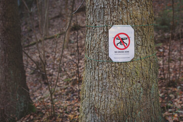 A warning sign prohibiting the use of drones in a protected landscape area to prevent disturbance...