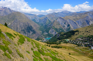 Fototapeta na wymiar Hiking near ski station Les deux Alpes and view on Alpine mountains peaks in summer, Isere, France