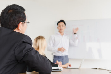 Business people brainstorming ideas for solving problems in company meeting rooms, the company staff meeting.
