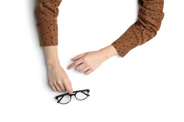 Woman with glasses on white background, top view. Closeup of hands