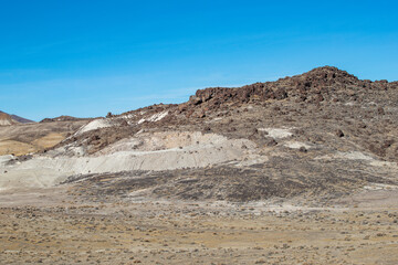 Tailings from a black fire opal mine in the Virgin Valley of Sheldon National Wildlife Refuge, Washoe County, Nevada.