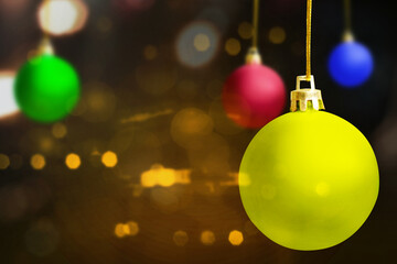 Colorful Christmas ball hanging with a colored background