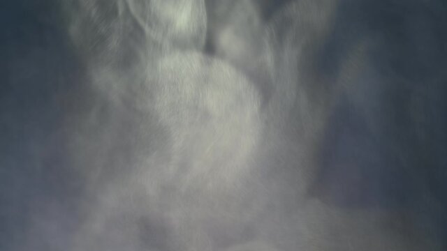 Gray smoke on a blue background, fog on a dark blue background