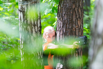 Girl with a gun playing laser tag