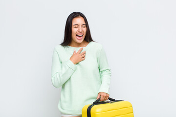 pretty woman laughing out loud at some hilarious joke, feeling happy and cheerful, having fun