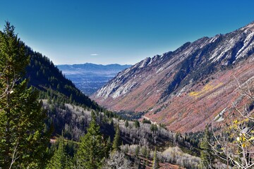 Fototapeta premium Red Pine Lake views from trail mountain landscape towards Salt Lake Valley in Little Cottonwood Canyon, Wasatch Rocky mountain Range, Utah, United States. 