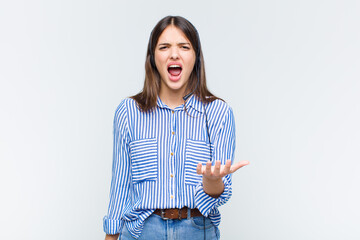 pretty woman looking angry, annoyed and frustrated screaming wtf or what’s wrong with you