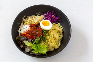 Korean food, JJolmyeon which is mixed with cold chewy noodles with vegetables and spicy sauce