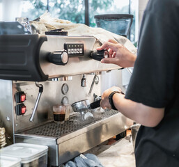 Barista Cafe Making Coffee Preparation Service Concept, Hands of a barista making coffee in the bar