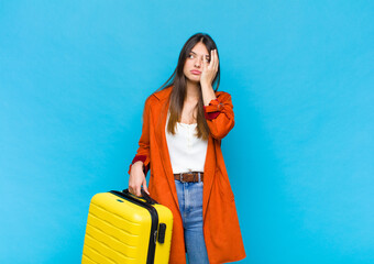 pretty woman feeling stressed, worried, anxious or scared, with hands on head, panicking at mistake
