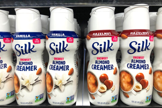 Alameda, CA - Oct 3, 2020: Grocery Store Shelf With Bottles Of Silk Brand Unsweet Almond Creamer. Vanilla And Hazelnut Flavors. Non GMO Verified.