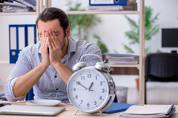 Hungry male employee waiting for food in time management concept