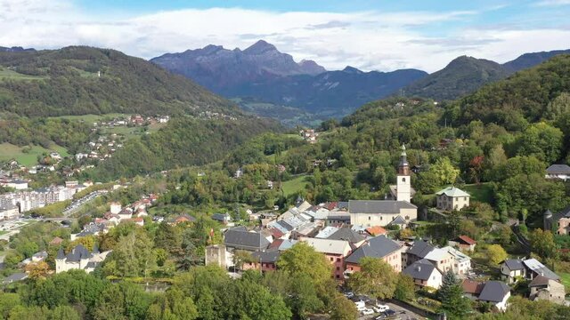 Aerial shot of the pretty old town (Conflans) overlooking Albertville, beautiful view of an old city surrounded by mountains,  View of the Conflans, the medieval city located in upper savoy, France
