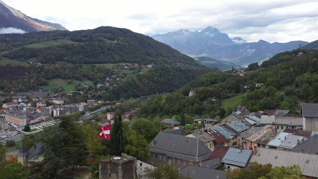 Aerial shot of the pretty old town (Conflans) overlooking Albertville, beautiful view of an old city surrounded by mountains,  View of the Conflans, the medieval city located in upper savoy, France