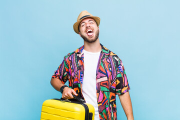 young man with cheerful, carefree, rebellious attitude, joking and sticking tongue out, having fun
