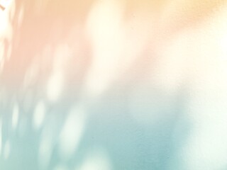Full frame shot of abstract pastel wall background with tree shades and sunlights.