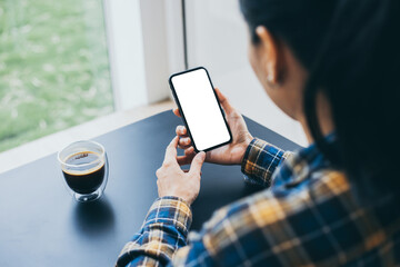 cell phone blank white screen mockup.woman hand holding texting using mobile on desk at office.background empty space for advertise.work people contact marketing business,technology